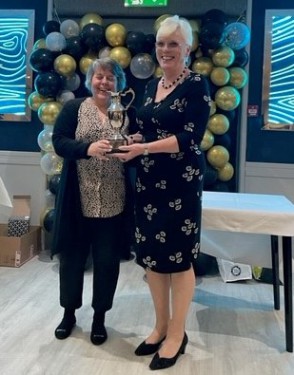 The new Roger Bara trophy presented to Dorothy Patterson (right)